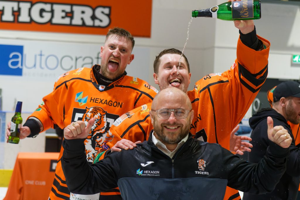 Pic: Steve Brodie: Coach Dougie Wildman gets the beer wash.