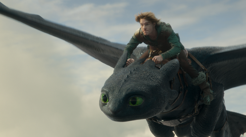 Night Fury dragon, Toothless, and Hiccup (Mason Thames) in Universal Pictures’ live-action How to Train Your Dragon, written and directed by Dean DeBlois.